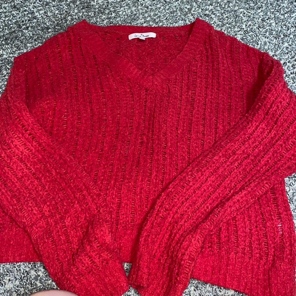 red sweater, a little shorter in length but not cropped